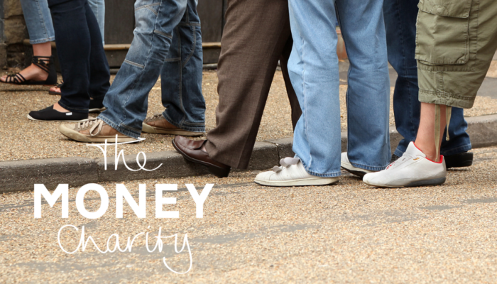 The Money Statistics June 2024 - UK’s Improving Big Picture Yet to Impact Individuals - Image shows the lower halves of a group of people, all standing in a line or queue, giving the impression of people waiting for something.